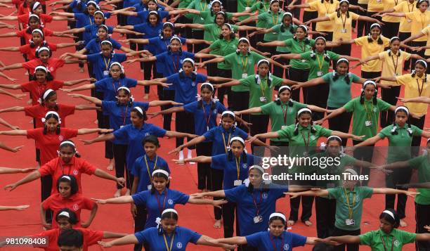 Students of Abhinav English Medium School, Ambegaon perform Yoga in the school premise on the occasion of World Yoga day, on June 21, 2018 in Pune,...