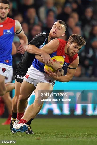 Robbie Gray of the Power tackles Jack Viney of the Demons during the round 14 AFL match between the Port Adelaide Power and the Melbourne Demons at...