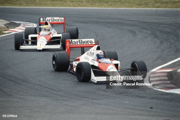 Alain Prost drives the Marlboro McLaren-Honda MP4/5 ahead of his team mate Ayrton Senna just before the two drivers would contoversially collide...