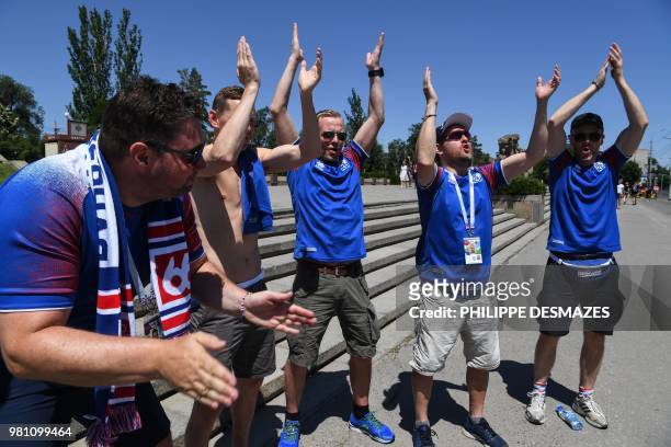 Supporters of Iceland's national football team clap while visiting visit the Mamayev Kurgan World War Two memorial complex in Volgograd on June 22...