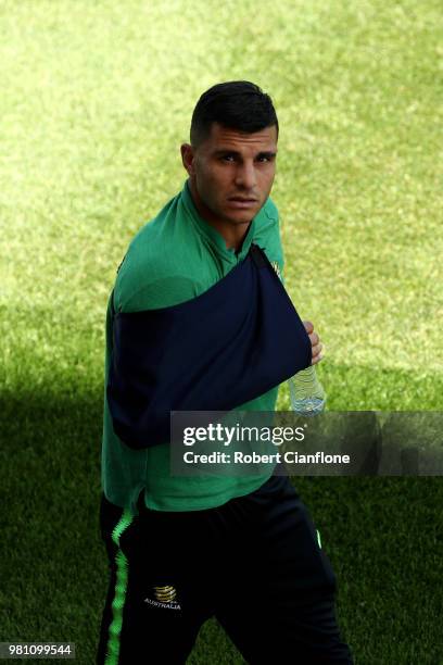 Andrew Nabbout of Australia looks on while wearing a sling after injuring himself in the game against Denmark during an Australian Socceroos training...