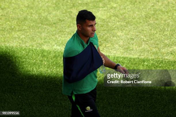Andrew Nabbout of Australia looks on while wearing a sling after injuring himself in the game against Denmark during an Australian Socceroos training...