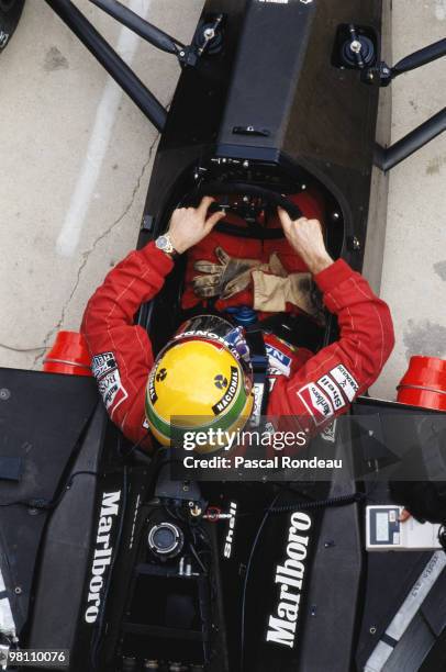 Ayrton Senna of Brazil sits in the cockpit of the Honda Marlboro McLaren McLaren MP4/5 Honda V10 during practice for the Spanish Grand Prix on 30th...