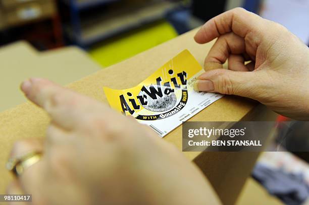 Dr Martens boots are packaged in the Dr Martens factory in Wellingborough, Northamptonshire, in central England, on March 18, 2010. What do British...