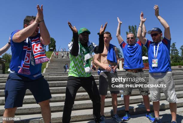 Iceland's and Nigerian supporters visit the Mamayev Kurgan World War Two memorial complex in Volgograd on June 22 hours before the Russia 2018 World...