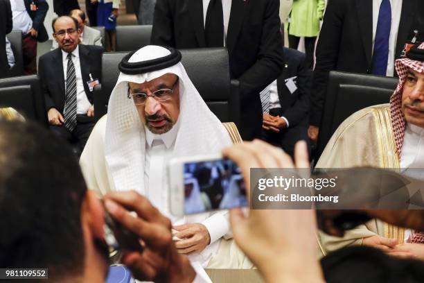 Khalid Al-Falih, Saudi Arabia's energy and industry minister, center, speaks to reporters ahead of the 174th Organization Of Petroleum Exporting...