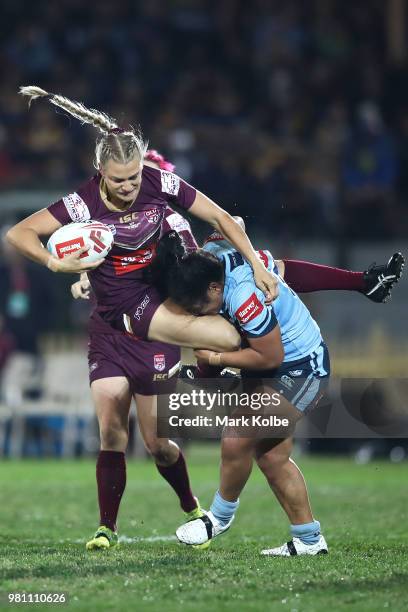 Kody House of the Maroons is tackled Elianna Walton of the Blues during the Women's State of Origin match between New South Wales and Queensland at...