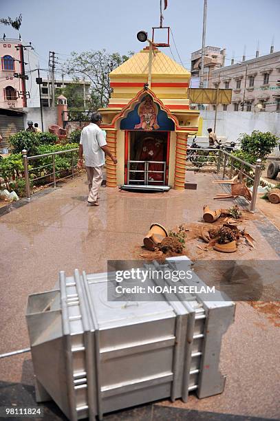 An Indian man looks at the destruction at the Hindu temple Shiv Mandir Goshala as communal violence continued in the Sha Ali Banda area of the old...