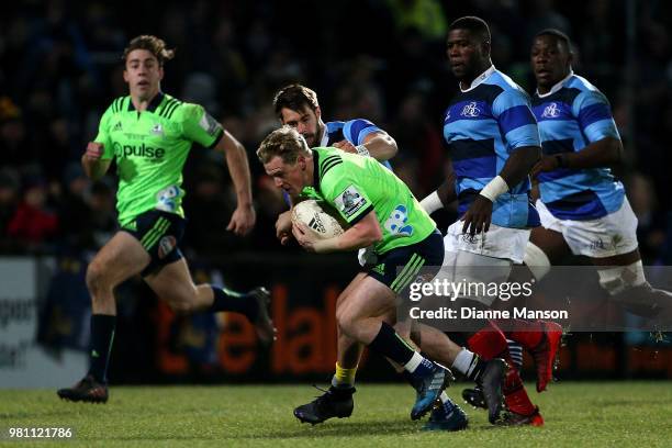 Josh Renton of the Highlanders makes a break during the match between the Highlanders and the French Barbarians at Rugby Park Stadium on June 22,...