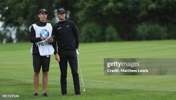 Thomas Pieters of Belguim looks on with his caddie during day two of the BMW International Open at Golf Club Gut Larchenhof on June 22, 2018 in...