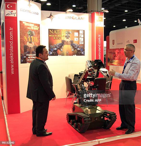 Man visits at Turkish exhibitor at the second Doha International Maritime Defence Exhibition and Conference which opened in Doha on March 29, 2010....