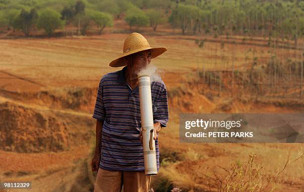 To go with feature story China-environment-drought by Dan Martin In a picture taken on March 24, 2010 a farmer, 64-year-old vegetable farmer Cai...