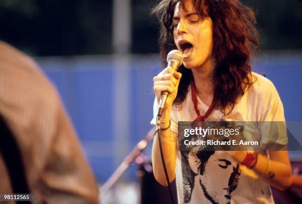 Patti Smith performs live on stage with The Patti Smith Group in Central Park as part of The Dr Pepper Music Festival on August 04 1978