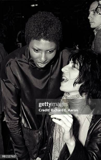 Patti Smith posed with Nona Hendryx from Labelle at a poetry reading night at a club called Local in New York City in 1975