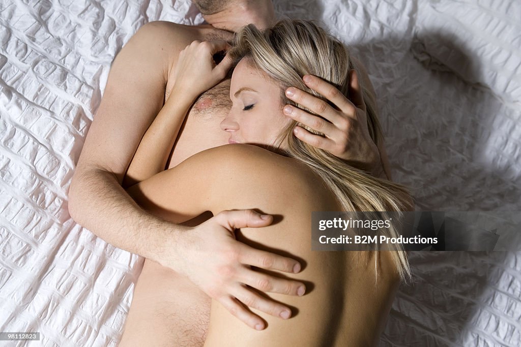 Couple sleeping on bed