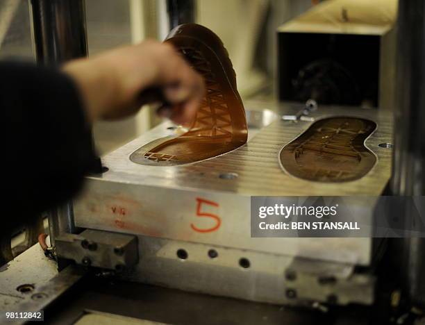 Dr Martens soles are moulded in the Dr Martens factory in Wellingborough, Northamptonshire, in central England, on March 18, 2010. What do British...