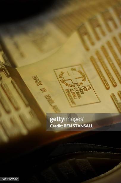 Dr Martens boot soles are pictured in the Dr Martens factory in Wellingborough, Northamptonshire, in central England, on March 18, 2010. What do...