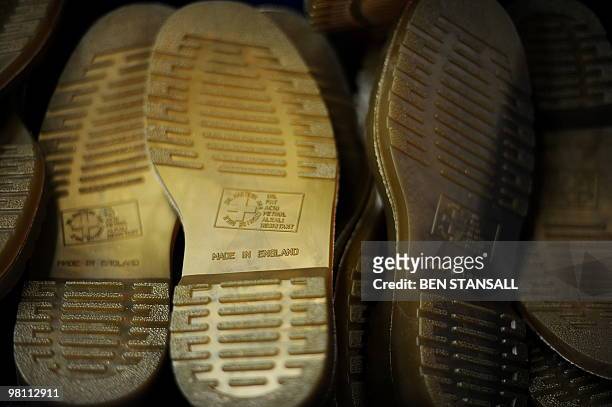 Dr Martens boot soles are pictured in the Dr Martens factory in Wellingborough, Northamptonshire, in central England, on March 18, 2010. What do...