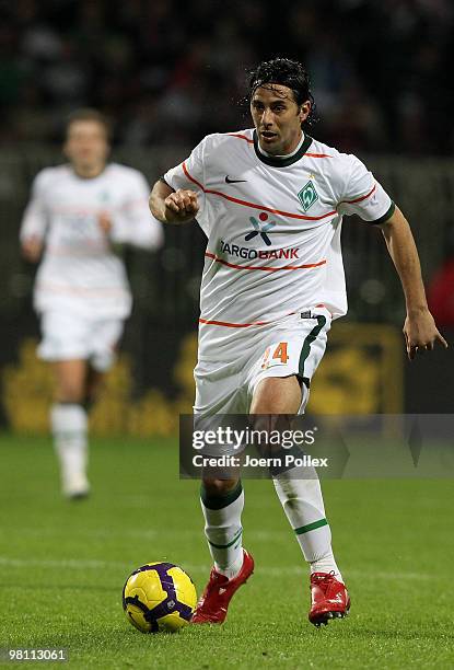 Claudio Pizarro of Bremen plays the ball during the DFB Cup Semi Final match between SV Werder Bremen and FC Augsburg at Weser Stadium on March 23,...