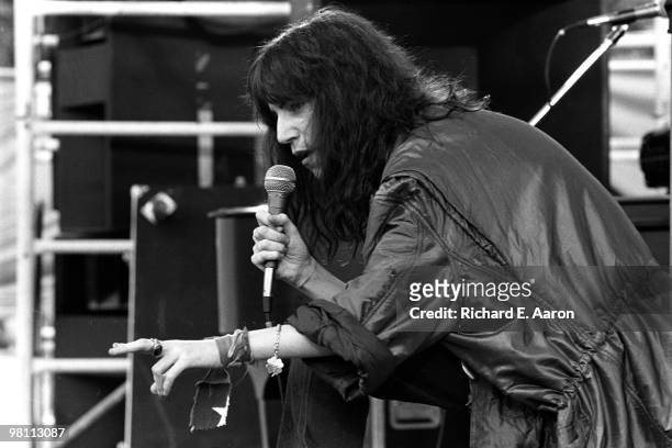 Patti Smith performing on stage with The Patti Smith Group in Central Park as part of The Dr Pepper Music Festival on August 04 1978