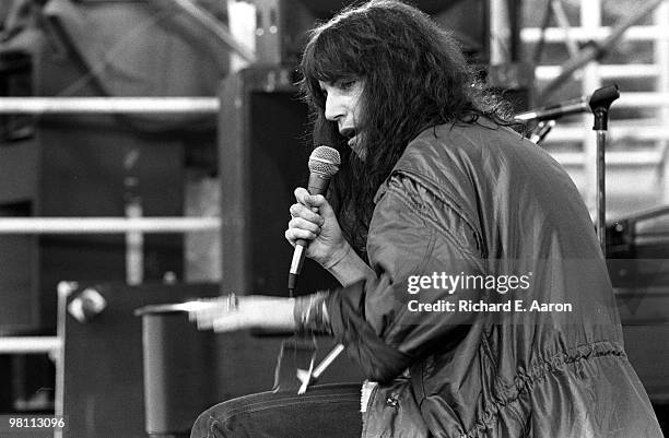 Patti Smith performing on stage with The Patti Smith Group in Central Park as part of The Dr Pepper Music Festival on August 04 1978