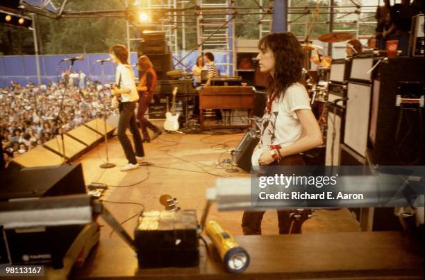 Patti Smith performing live on stage with The Patti Smith Group in Central Park as part of The Dr Pepper Music Festival on August 04 1978 L-R Lenny...