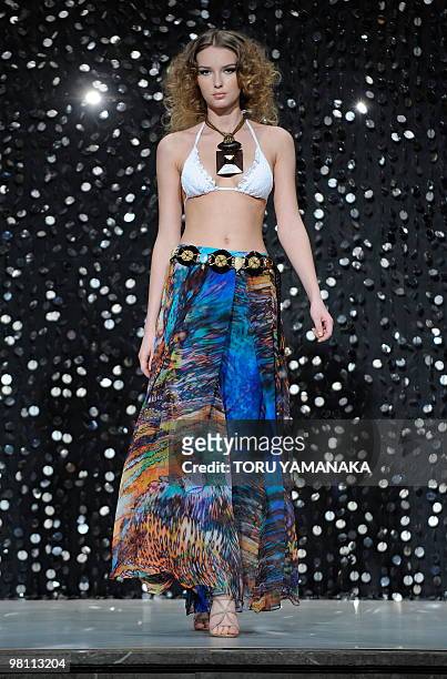 Model displays a creation during the ESCADA 2010 spring/summer collection to commemorate the opening of the German fashion brand shop at the...