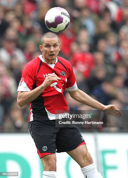 Leon Andreasen of Hannover heads the ball during the Bundesliga match between Hannover 96 and 1. FC Koeln at AWD Arena on March 27, 2010 in Hanover,...