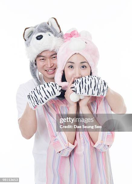 people, funny couple wearing wolf and fox fur hat - newfamily stock pictures, royalty-free photos & images