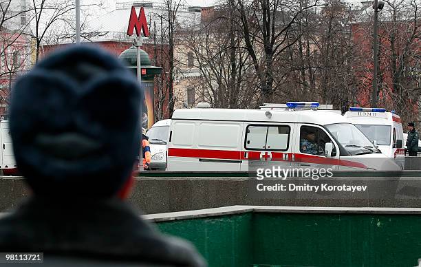 Russian policemen are seen in front of the Lubyanka metro station entrance on March 29, 2010 in Moscow, Russia. At least 35 people were killed as two...