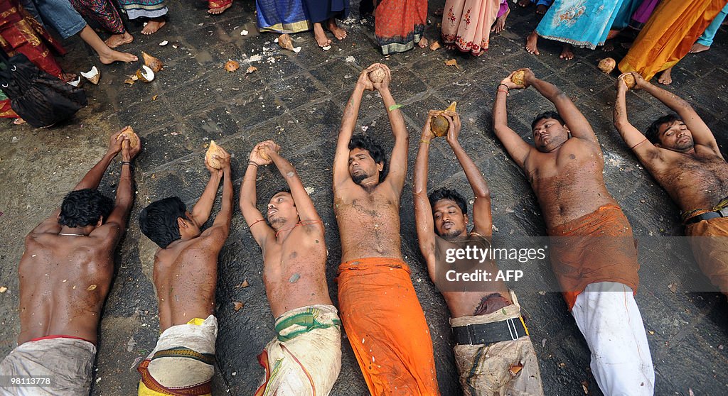 Sri Lankan Tamil Hindu devotees roll on