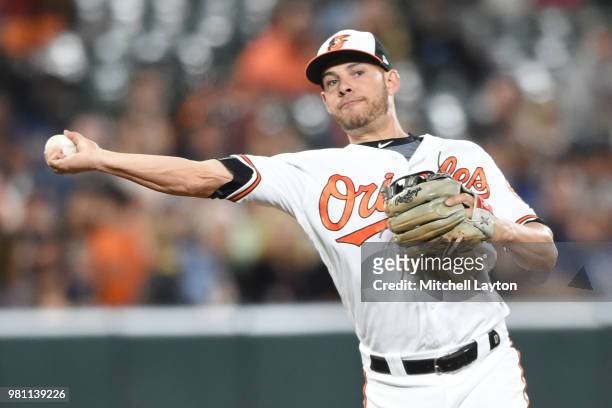 Danny Valencia of the Baltimore Orioles filed a ground ball during a baseball game against the Boston Red Sox at Oriole Park at Camden Yards on June...