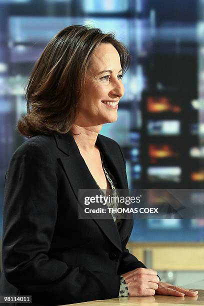 France's region Poitou-Charentes re-elected socialist president Segolene Royal gets ready to attend French TV channel TF1's evening news on March 23,...