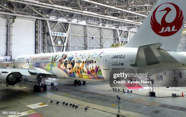 Japan Airlines Co. Boeing 767-300ER passenger jet with Disney-themed livery in commemoration of the 35th anniversary of the opening of Tokyo Disney...