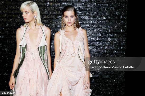 Models Marjan Jonkman and Luna Bijl pose backstage ahead of the Dsquared2 show during Milan Men's Fashion Week Spring/Summer 2019 on June 17, 2018 in...