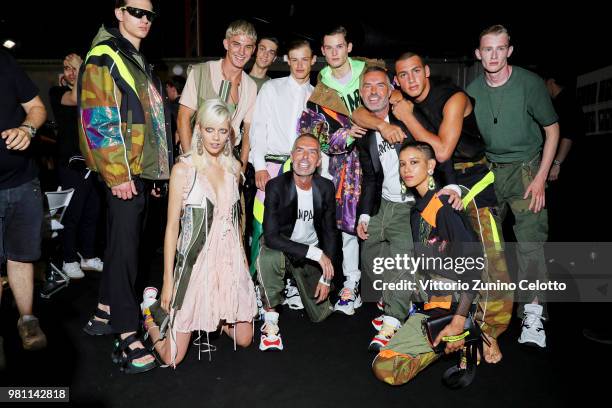 Dan Caten and Dean Caten pose backstage with models ahead of the Dsquared2 show during Milan Men's Fashion Week Spring/Summer 2019 on June 17, 2018...