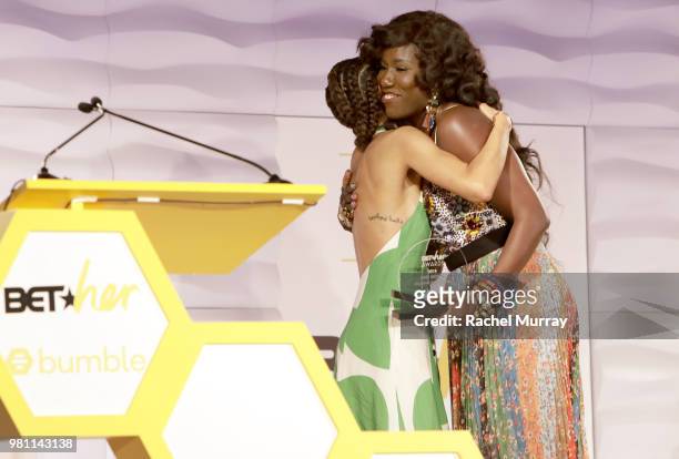 Bozoma Saint John and Journalist and editor Elaine Welteroth hug onstage during the BET Her Awards presented by Bumble at Conga Room on June 21, 2018...