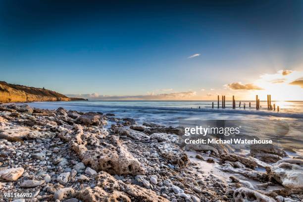 rocky coastline at sunset, port willunga, adelaide, south australia - adelaide stock pictures, royalty-free photos & images