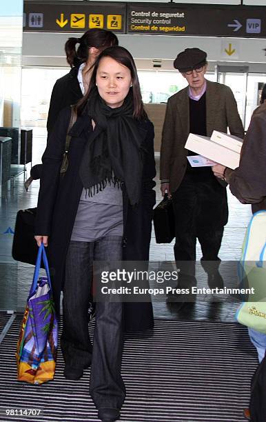 Woody Allen and wife Soon-Yi Previn arrive at El Prat Airport on March 29, 2010 in El Prat de Llobregat, Spain.