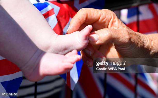Camilla, Duchess of Cornwall, tickles a baby's feet as she greets well-wishers during the royal visit to Salisbury on June 22, 2018 in Salisbury,...