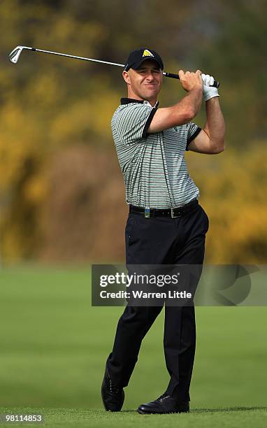 Robert Coles of England plays his second shot into the 15th green during the fourth round of the Open de Andalucia 2010 at Parador de Malaga Golf on...