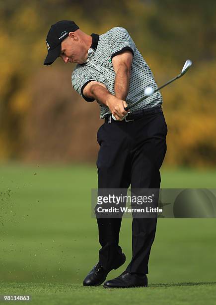Robert Coles of England plays his second shot into the 15th green during the fourth round of the Open de Andalucia 2010 at Parador de Malaga Golf on...