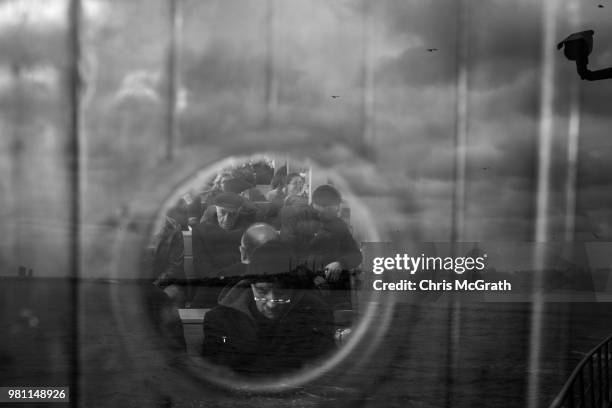 People ride the ferry overlayed by the skyline of the Blue Mosque and Hagia Sofia on February 19, 2018 in Istanbul, Turkey. With Turkey being just...