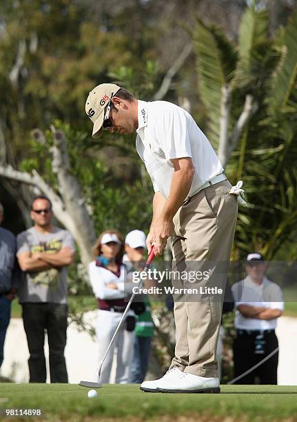 Louis Oosthuizen of South Africa putts on the 17th green during the fourth round of the Open de Andalucia 2010 at Parador de Malaga Golf on March 28,...