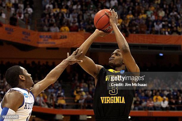 Devin Ebanks of the West Virginia Mountaineers attempts a shot against the Kentucky Wildcats during the east regional final of the 2010 NCAA men's...