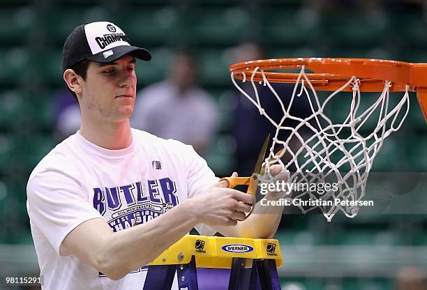 Andrew Smith of the Butler Bulldogs cuts down the net after defeating the Kansas State Wildcats in the west regional final of the 2010 NCAA men's...