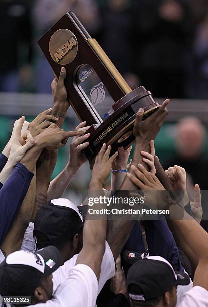 The Butler Bulldogs celebrate with the west regional trophy after defeating the Kansas State Wildcats in the west regional final of the 2010 NCAA...