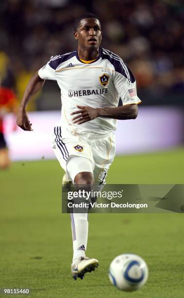 Edson Buddle of the Los Angeles Galaxy paces the ball on the attack against the New England Revolution during their MLS match at the Home Depot...