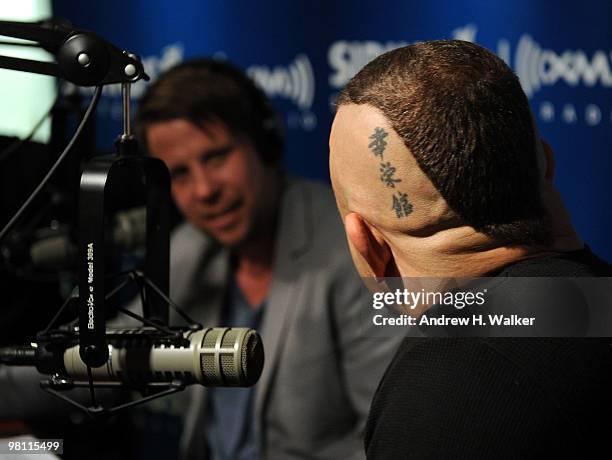 Filip Hammar and Chuck Liddell talk during their visit to the SIRIUS XM Studio on March 29, 2010 in New York City.