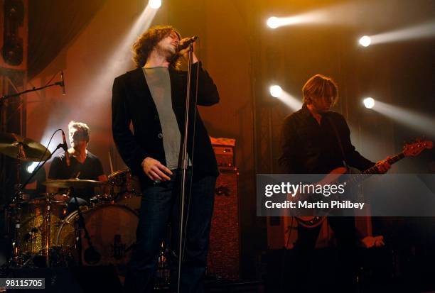 Jon Coghill, Bernard Fanning and John Collins of Powderfinger perform on stage at the Forum Theatre on 6th June 2007 in Melbourne, Australia.